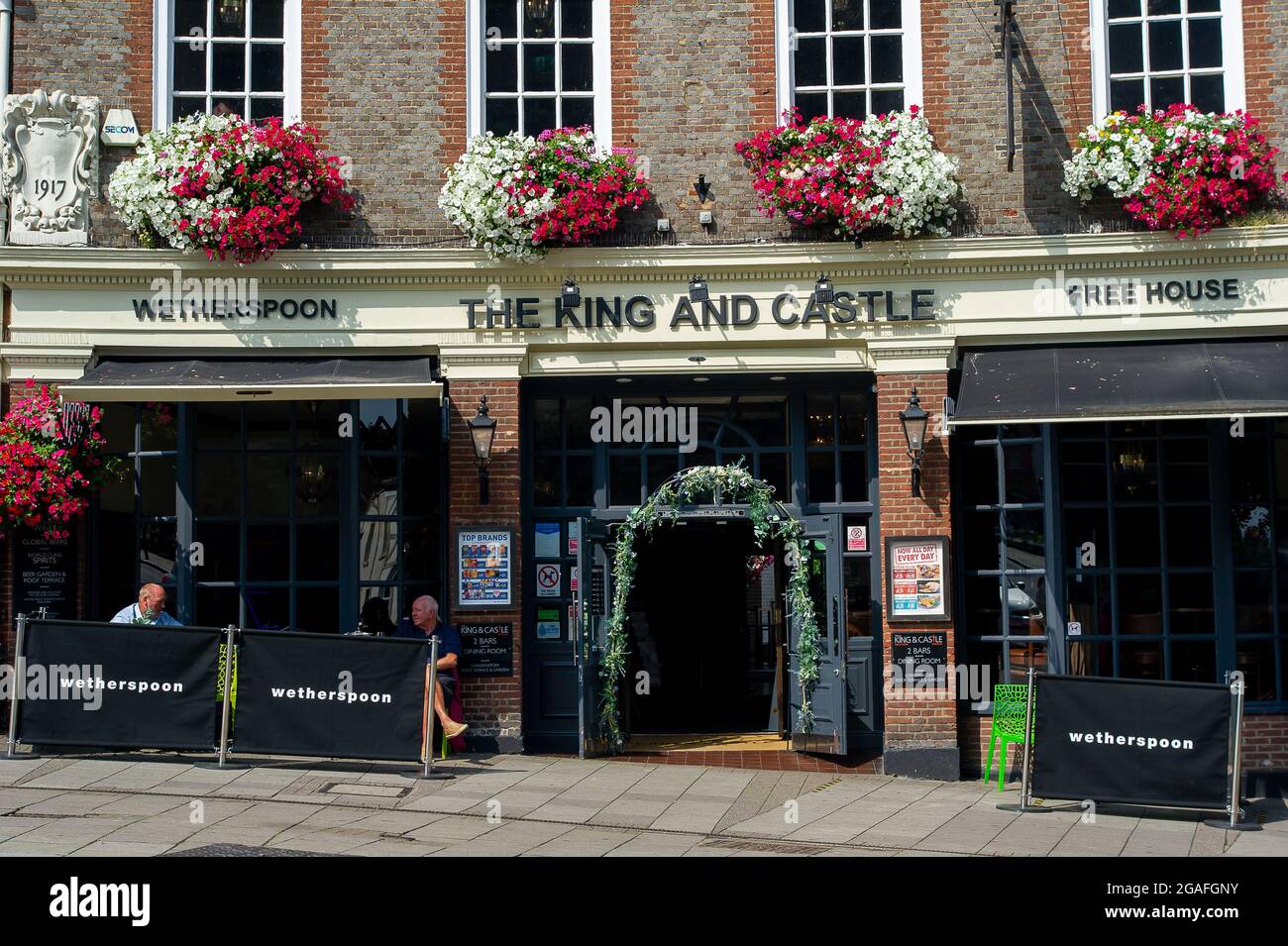 Windsor, Berkshire, UK. 26th July, 2021. The King and Castle Wetherspoon pub in Windsor. Tim Martin of pub chain J D Wetherspoon has reportedly warned that the post Covid-19 recovery is likely to be set of course due to the NHS Covid-19 Test and Trace app pings. Credit: Maureen McLean/Alamy Stock Photo