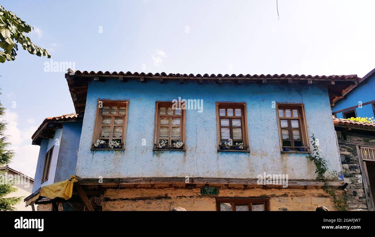 Low angle shot of an old building with blue walls Stock Photo - Alamy