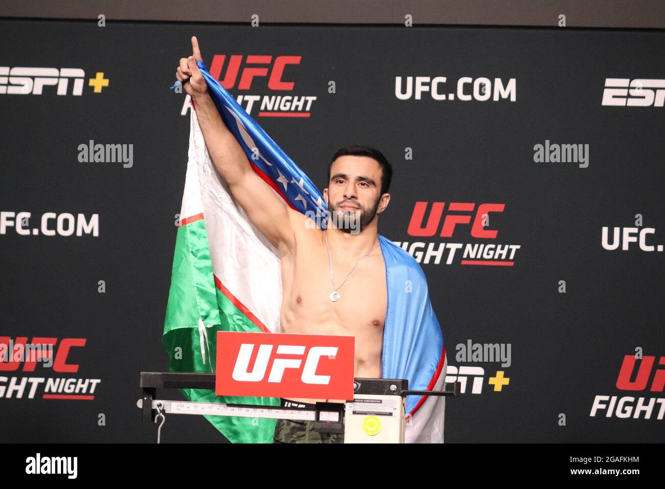 Las Vegas, USA. 30th July, 2021. LAS VEGAS, NV - JULY 30: Zarrukh Adashev poses on the scale during the UFC Vegas 33: Hall vs Strickland Weigh-in at UFC Apex on July 30, 2021 in Las Vegas, Nevada, United States. (Photo by Diego Ribas/PxImages) Credit: Px Images/Alamy Live News Stock Photo