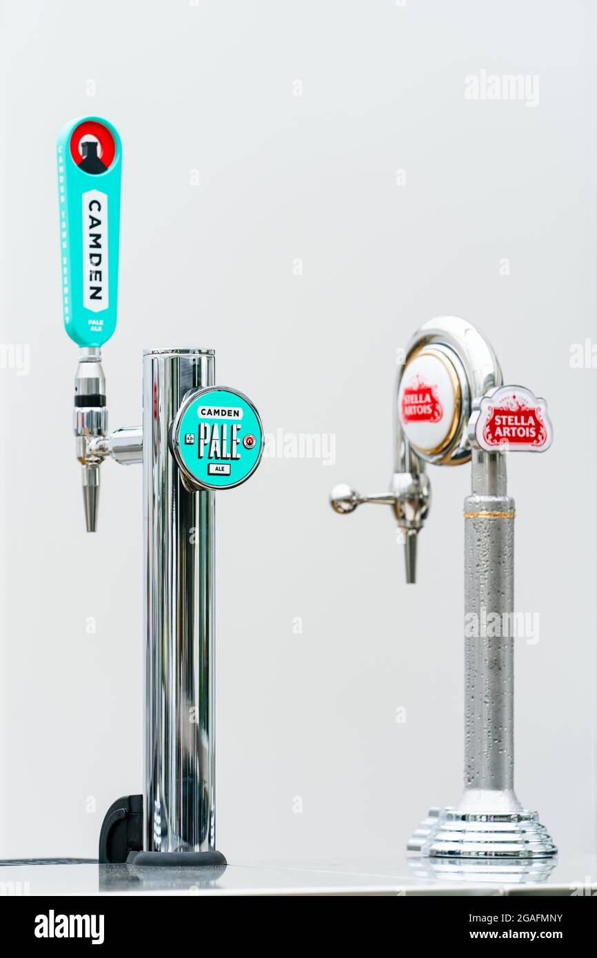 Stella Artois and Camden Town Brewery beer pumps at a Bar Stock Photo