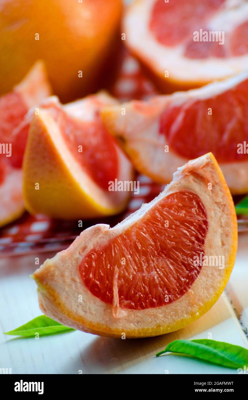 sliced ripe grapefruit on a white background Stock Photo
