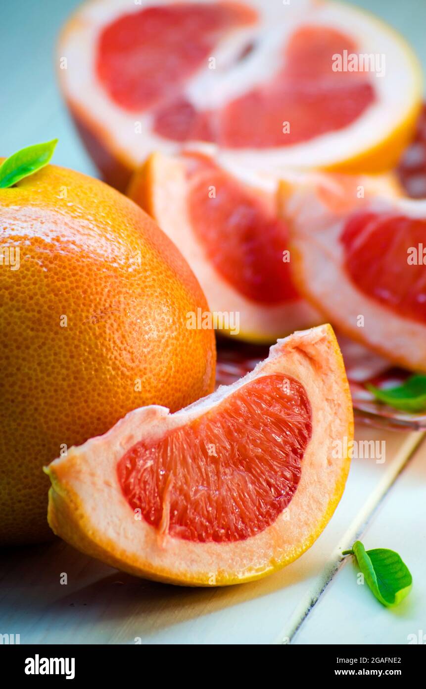 sliced ripe grapefruit on a white background Stock Photo