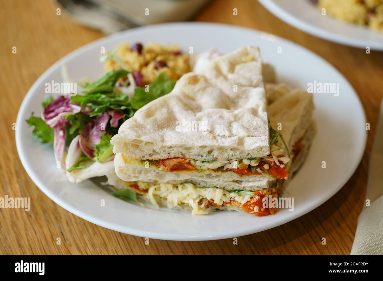Tomato, cheese and pesto sandwich in a cafe Stock Photo Alamy