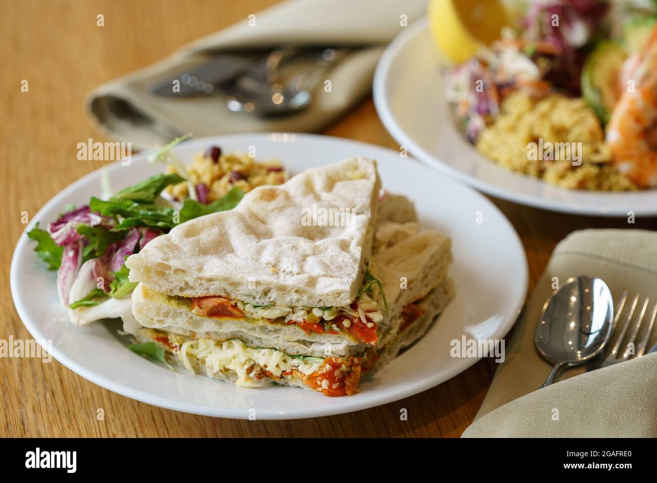 Tomato, cheese and pesto sandwich in a cafe Stock Photo Alamy