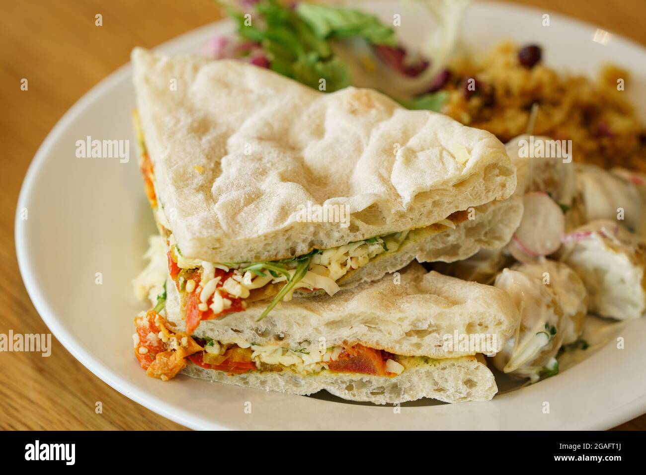 Tomato, cheese and pesto sandwich in a cafe Stock Photo Alamy