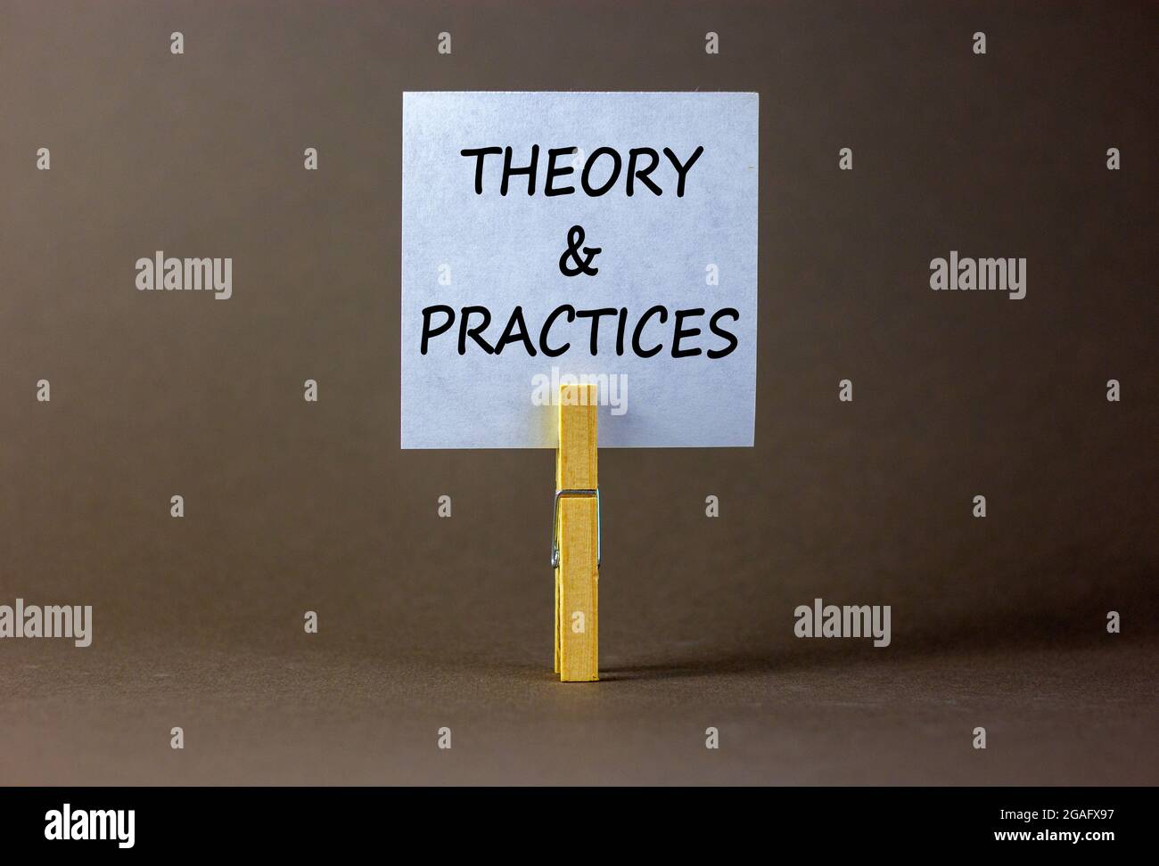 Theory and practice symbol. White paper with words 'Theory and practice ...