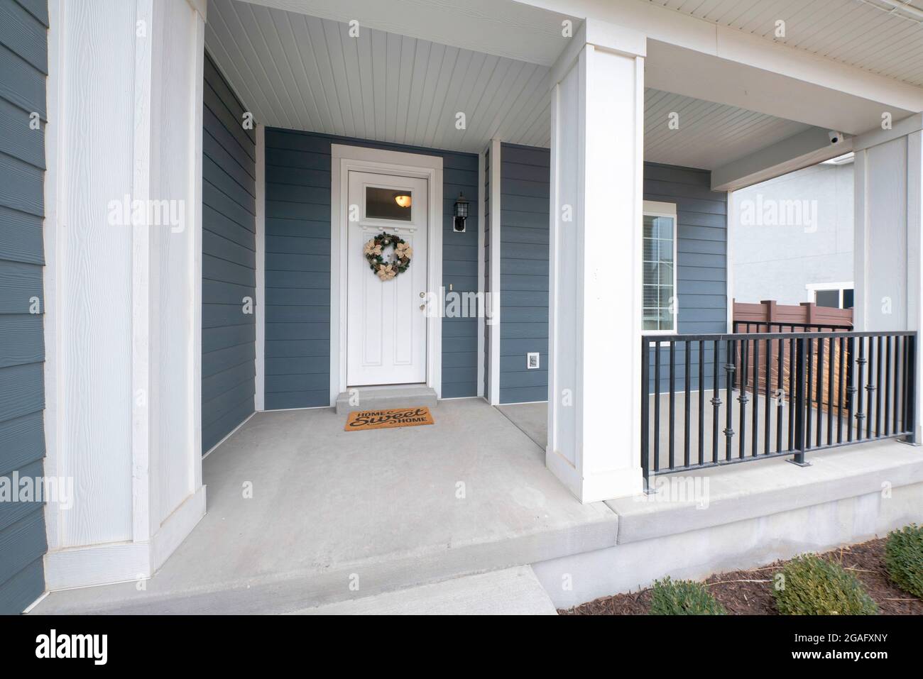 Exterior of a front porch of a house with gray and white tones Stock