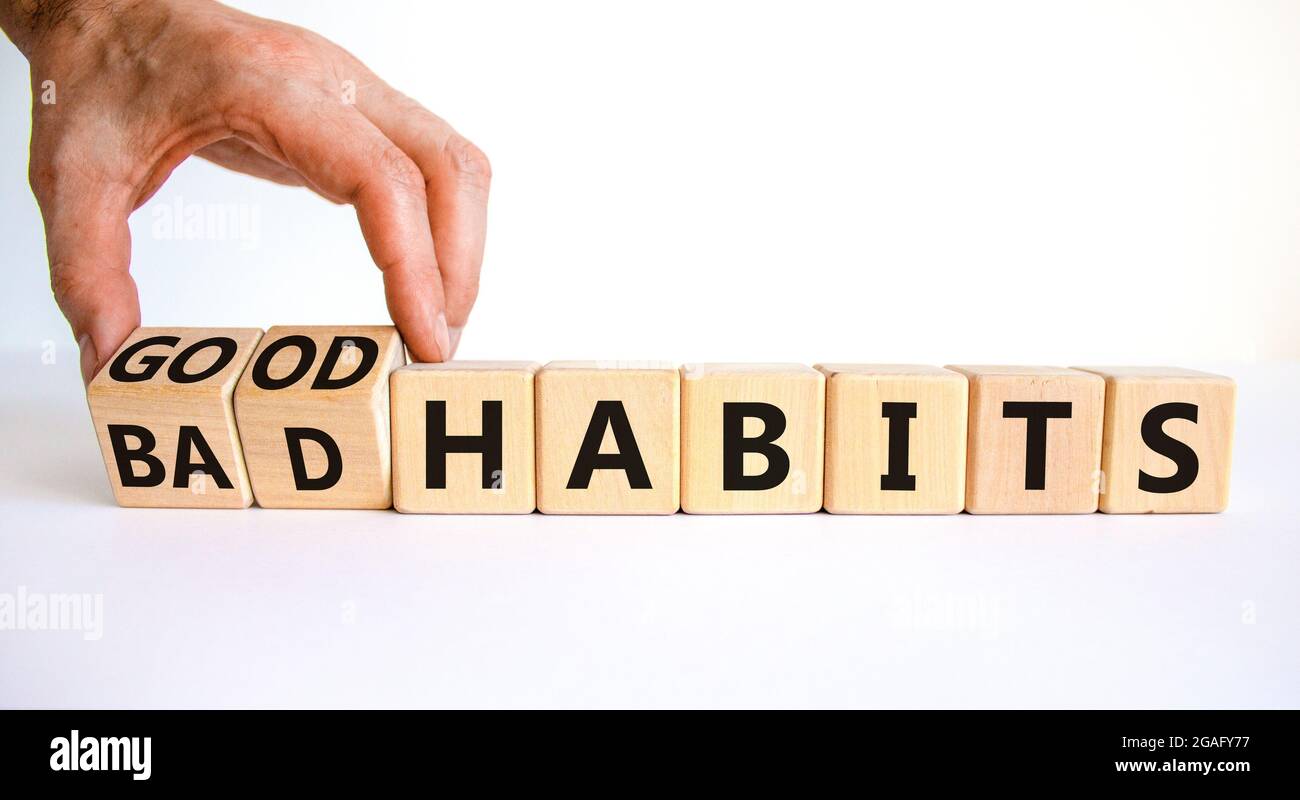 Good or bad habits symbol. Businessman turns wooden cubes and changes ...