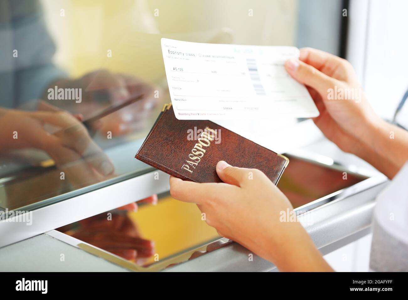 Airport Check-In Counters With Passengers Stock Photo - Alamy