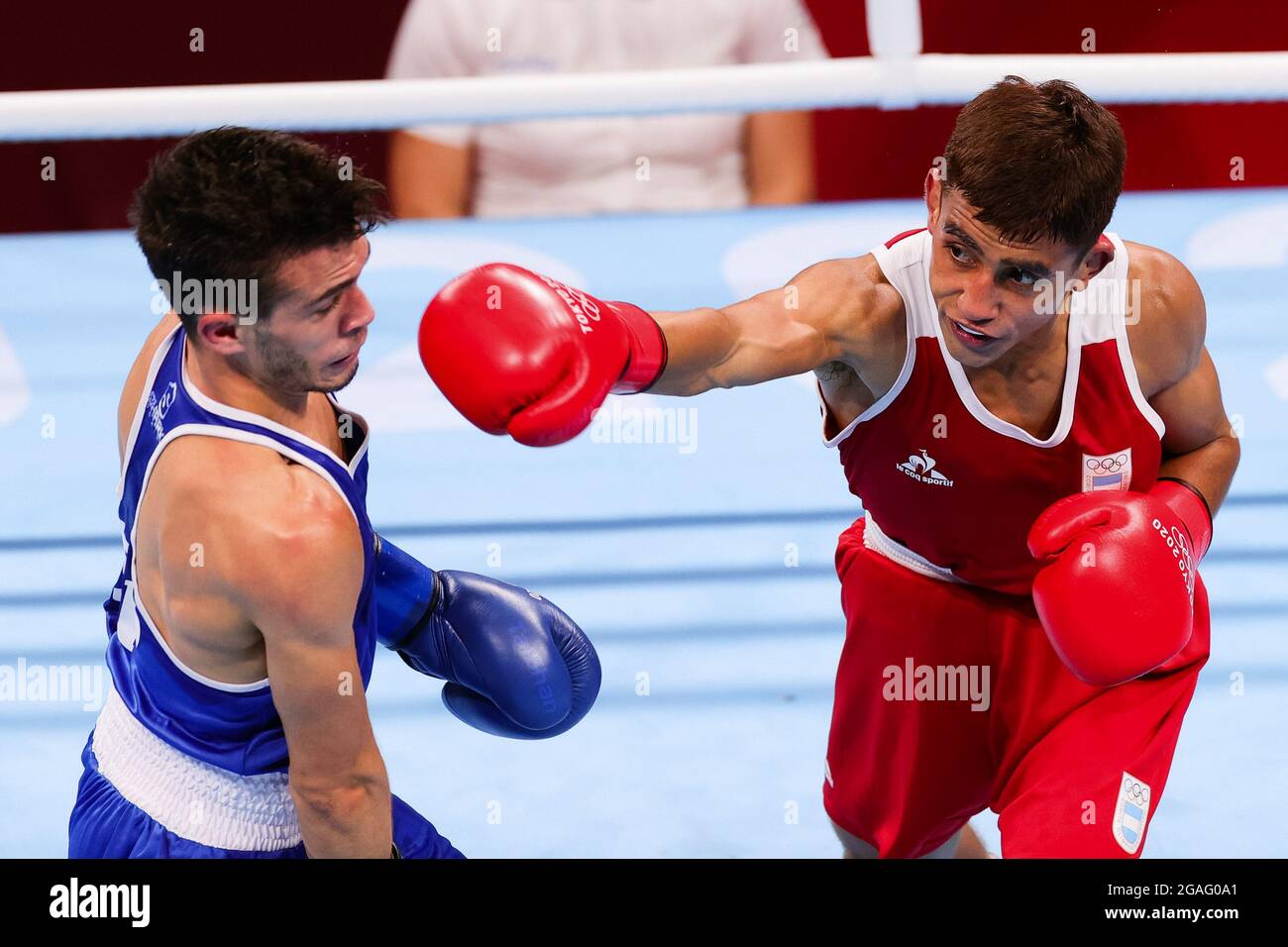 Tokyo, Japan, 26 July, 2021. Ramon Nicanor QUIROGA of Argentina throws a punch during the Men's Flyweight Boxing Preliminary match between Gabriel ESCOBAR MASCUNANO of Spain and Ramon Nicanor QUIROGA of Argentina on Day 3 of the Tokyo 2020 Olympic Games. Credit: Pete Dovgan/Speed Media/Alamy Live News Stock Photo