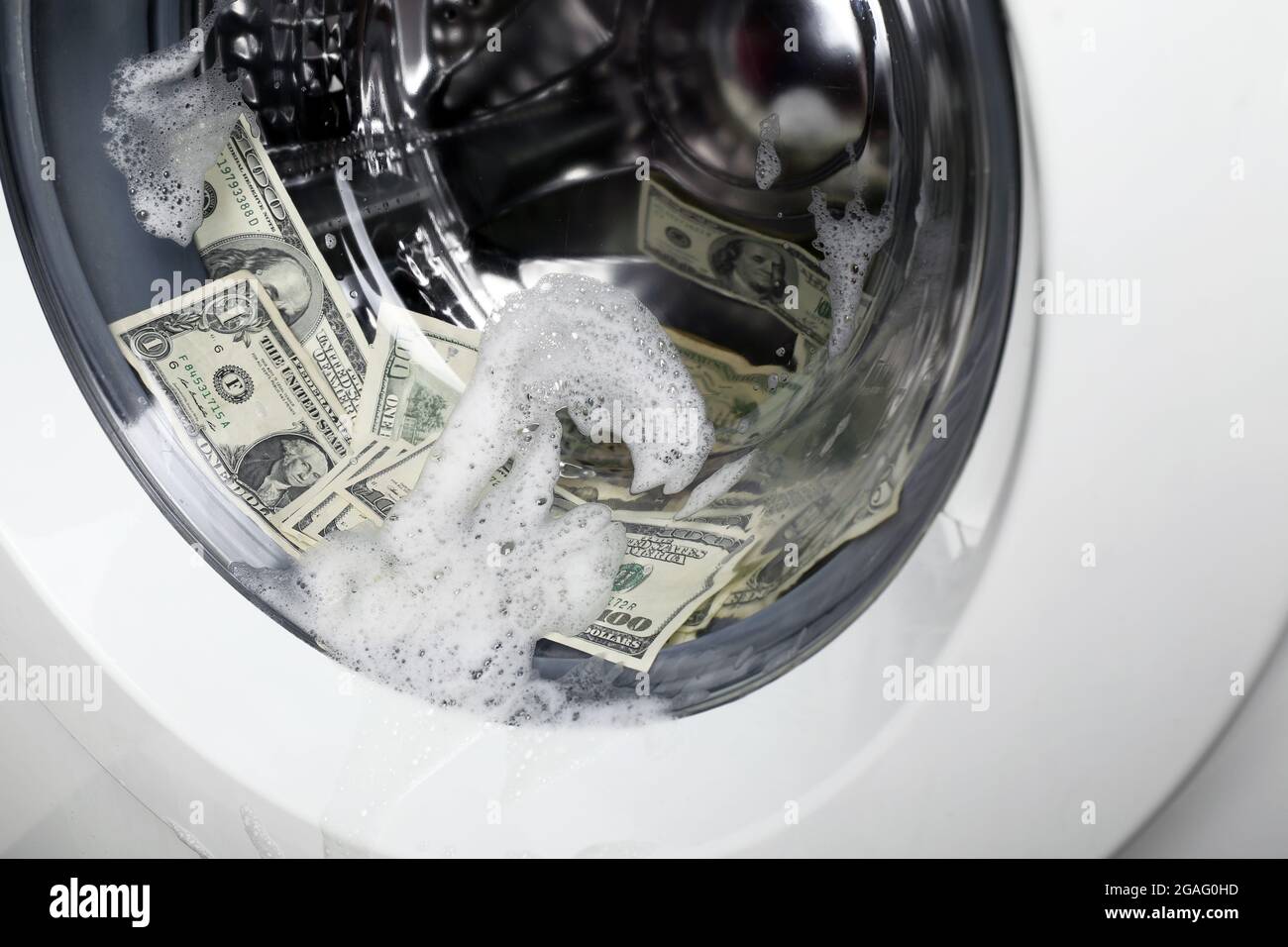 Laundering of money in washing machine, close up Stock Photo Alamy