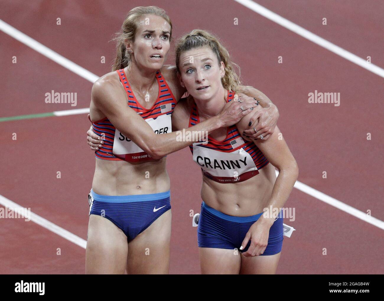 Tokyo, Japan. 30th July, 2021. Elise Cranny of the USA (R) hugs compatriot Karissa Schweizer after they both qualified for the finals of the Women's 3000m at the Athletics competition during the Tokyo Summer Olympics in Tokyo, Japan, on Friday, July 30, 2021. Photo by Bob Strong/UPI. Credit: UPI/Alamy Live News Stock Photo