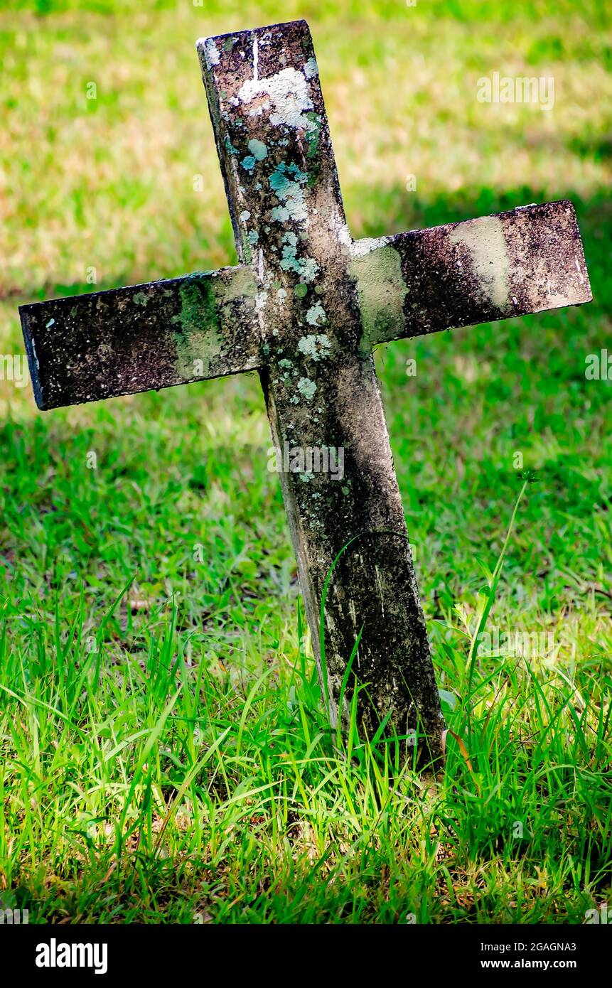 A concrete cross stands in Blakeley Cemetery in Historic Blakeley State Park, June 26, 2021, in