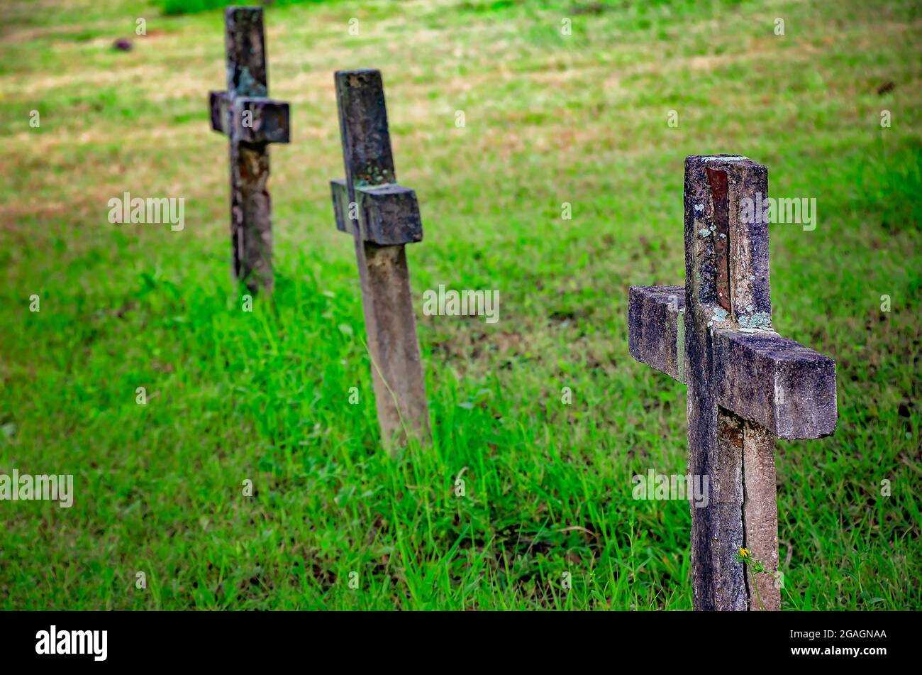 Concrete crosses stand in Blakeley Cemetery in Historic Blakeley State Park, June 26, 2021, in