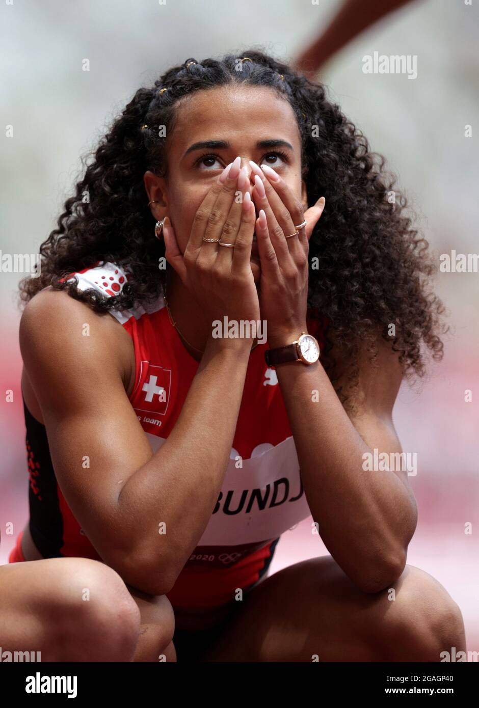 Tokyo 2020 Olympics Athletics Women S 100m Hurdles Round 1 Ols Olympic Stadium Tokyo Japan July 31 2021 Ditaji Kambundji Of Switzerland Reacts After Competing In Heat 5 Reuters Hannah Mckay Stock Photo Alamy [ 1390 x 940 Pixel ]