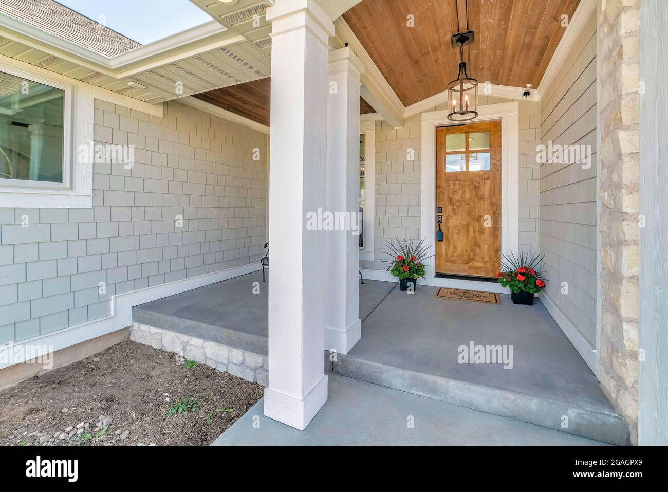 Front porch exterior of a house with decorated concrete block siding
