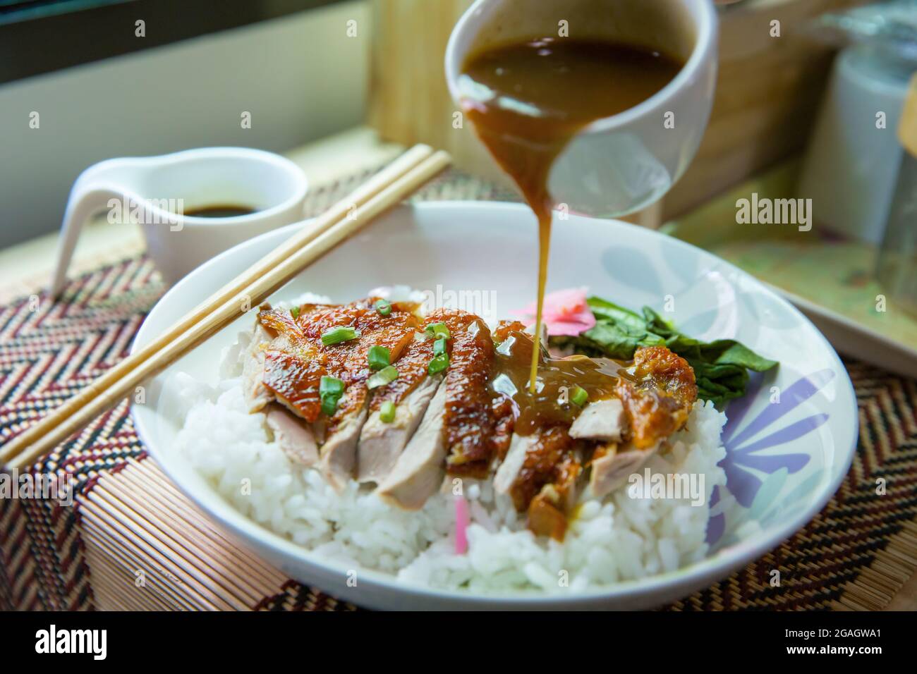 Roasted duck topping on thai rice, Roasted bbq duck pour with gravy