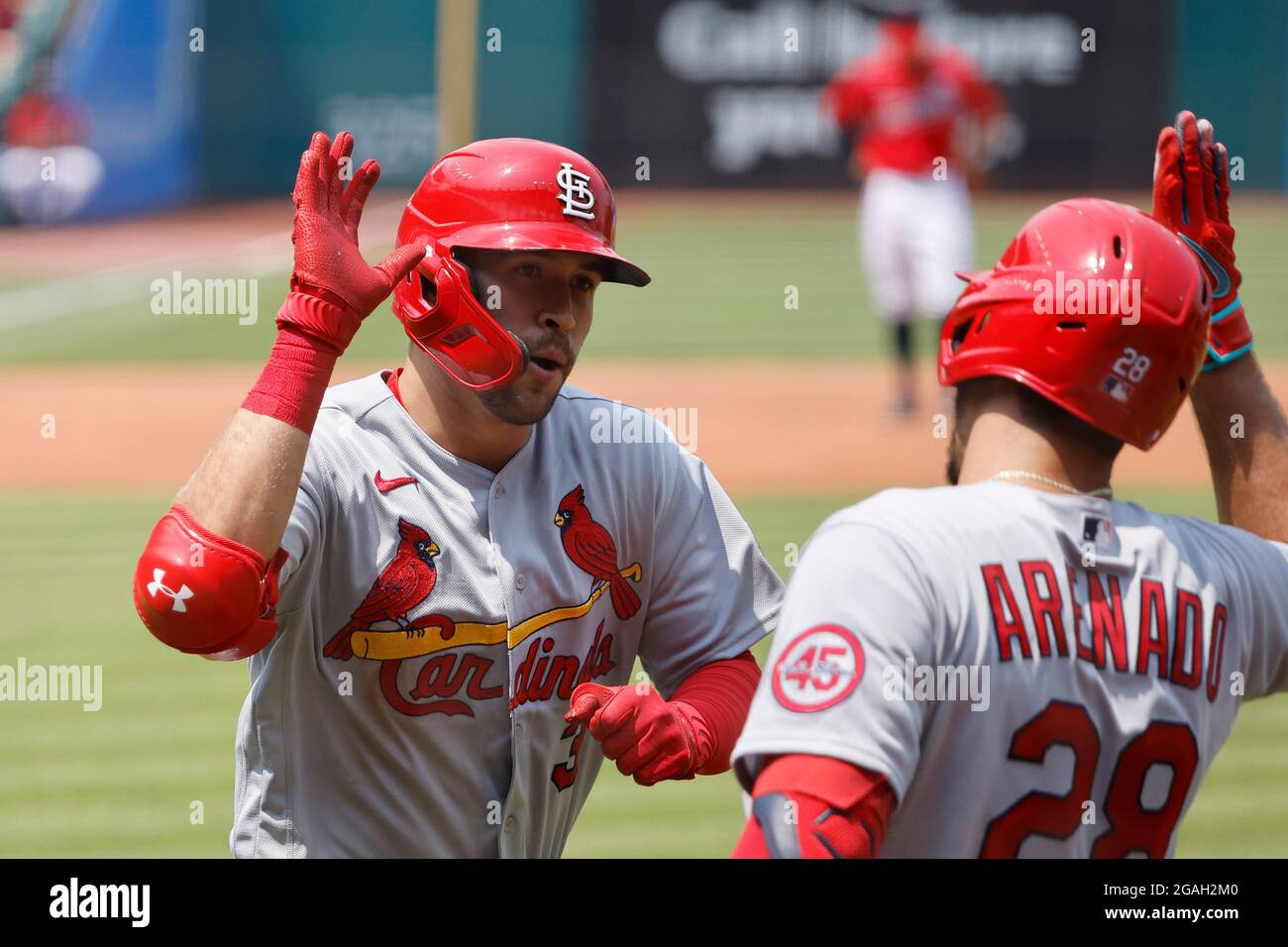 CLEVELAND, OH - JULY 28: Dylan Carlson (3) of the St. Louis Cardinals celebrates with Nolan Arenado (28) after hitting a home run during a game agains Stock Photo