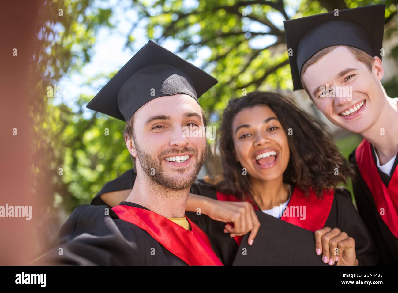 Graduates Bunch A group of graduates spending time together and feeling united Stock ...
