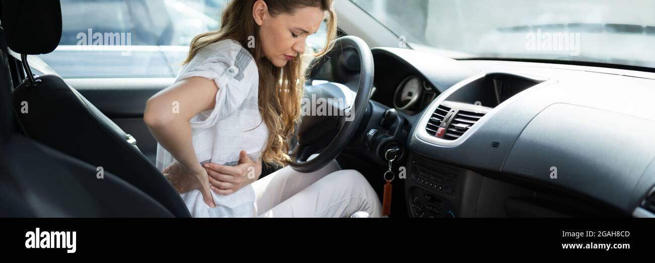 Injury And Car Accident. Whiplash And Hurt Back Stock Photo