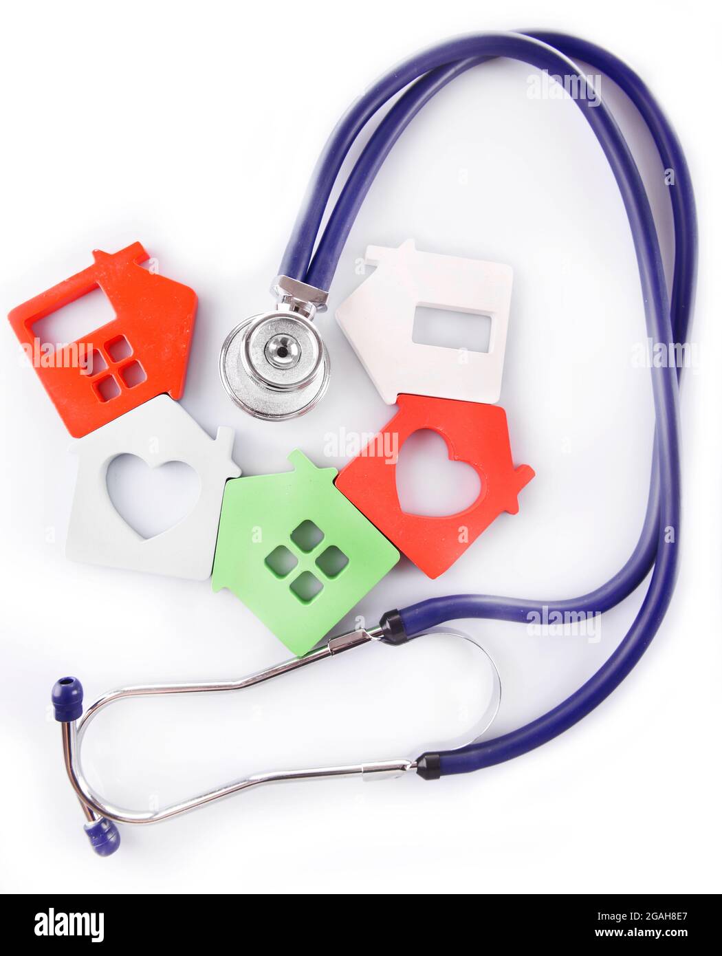 Concept of family medicine colourful houses and stethoscope isolated