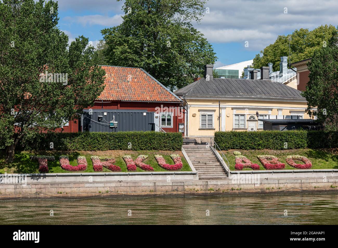 Floral composition or flowerbeds in the shape of TURKU ÅBO on the riverbank in Turku, Finland Stock Photo