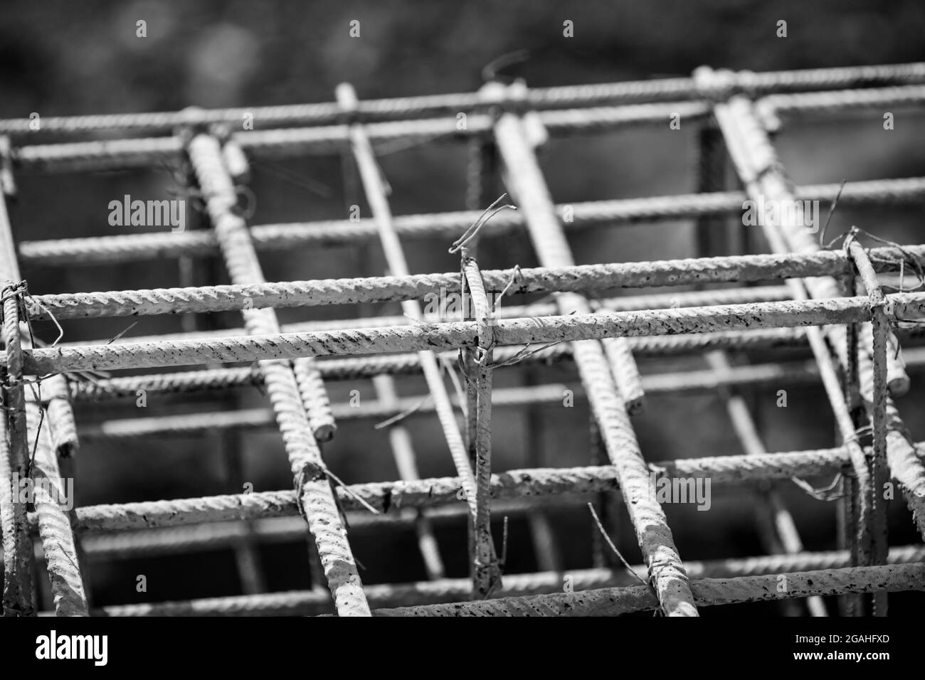 Shallow depth of field (selective focus) image with steel used for reinforcing concrete, on a construction site. Stock Photo