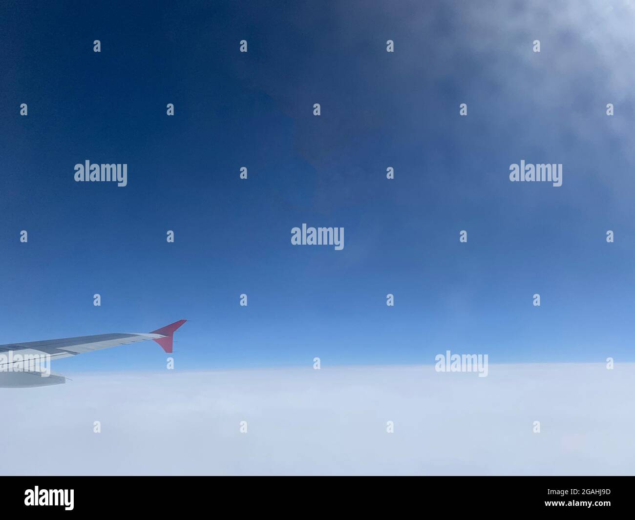 Blue sky view from aircraft window Stock Photo - Alamy