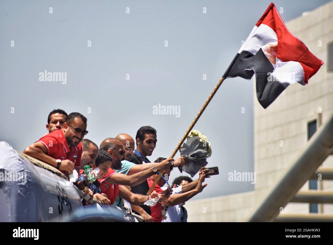 Cairo Governorate, Egypt. 28th July, 2021. Cairo, Egypt. 28 July 2021. Egyptian athletes Hedaya Malak and Saif Issa receive a warm welcome as they arrive at Cairo Airport after winning the bronze medal at the 2020 Tokyo Olympics. Hedaya Malak and Seif Issa are players of taekwondo who won the bronze medal in the 67 and 80 Kg weight category respectively at the Olympic Games in Tokyo. Hedaya Malak won the medal in the women's singles competitions after defeating the American Peggy McPherson 17/6, while Saif Issa won the medal in the men's singles competitions after defeating Norway's Stock Photo