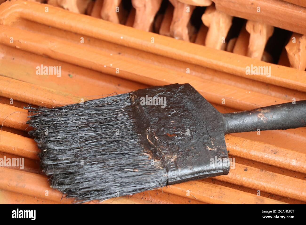 Very old and dirty paint brush left uncleaned after painting job. Used