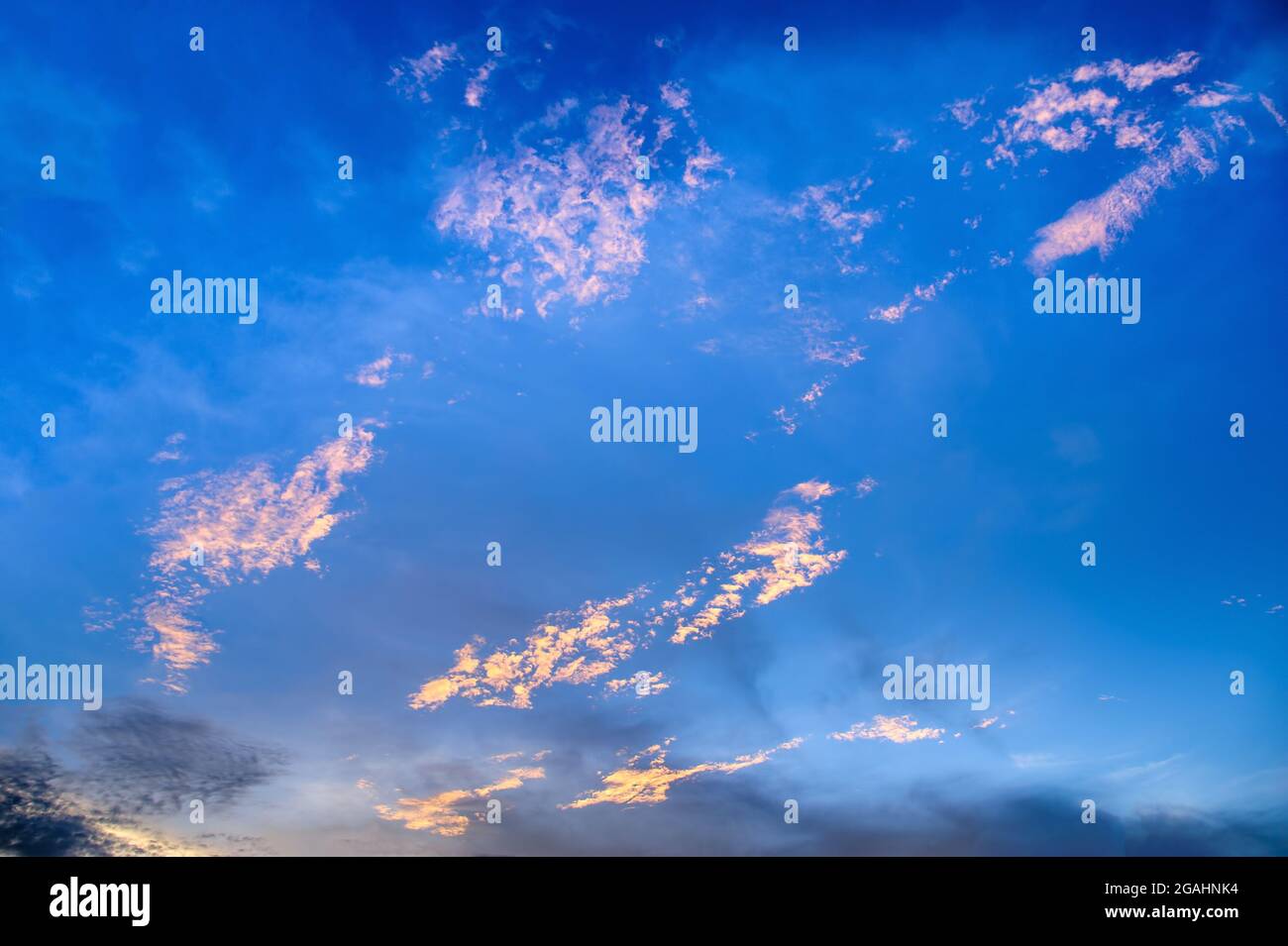vivid blue sky with clouds Stock Photo - Alamy