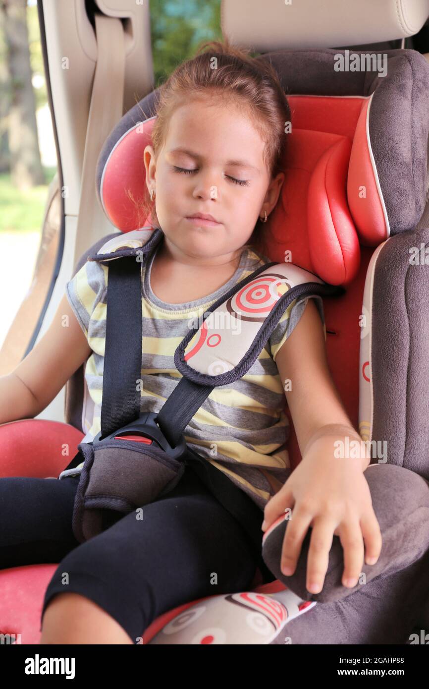 Adorable little girl sleeping in the car Stock Photo Alamy