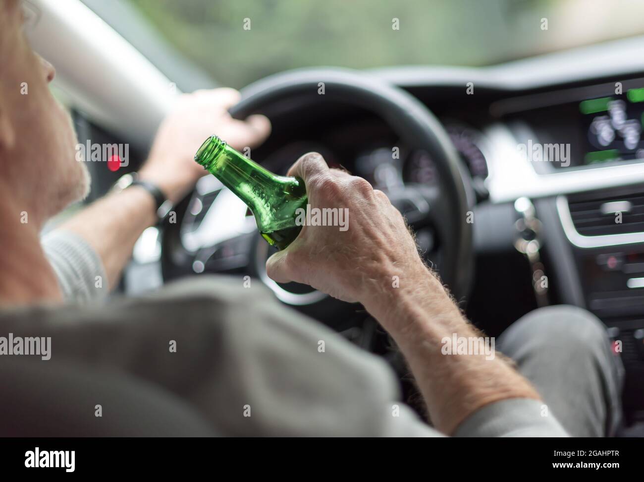 Man drinking a beer while driving Stock Photo Alamy