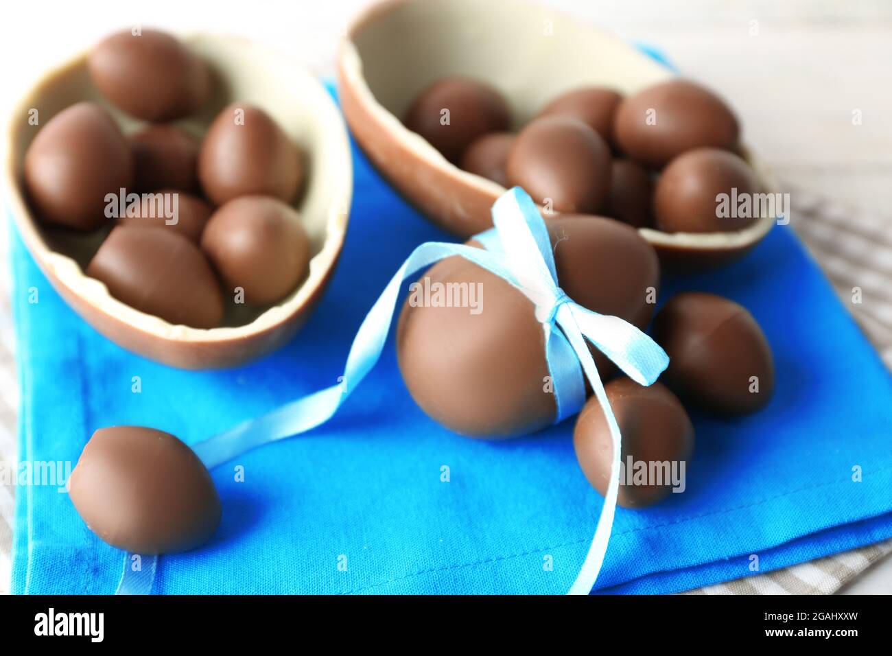 Chocolate Easter eggs on white wooden background Stock Photo - Alamy