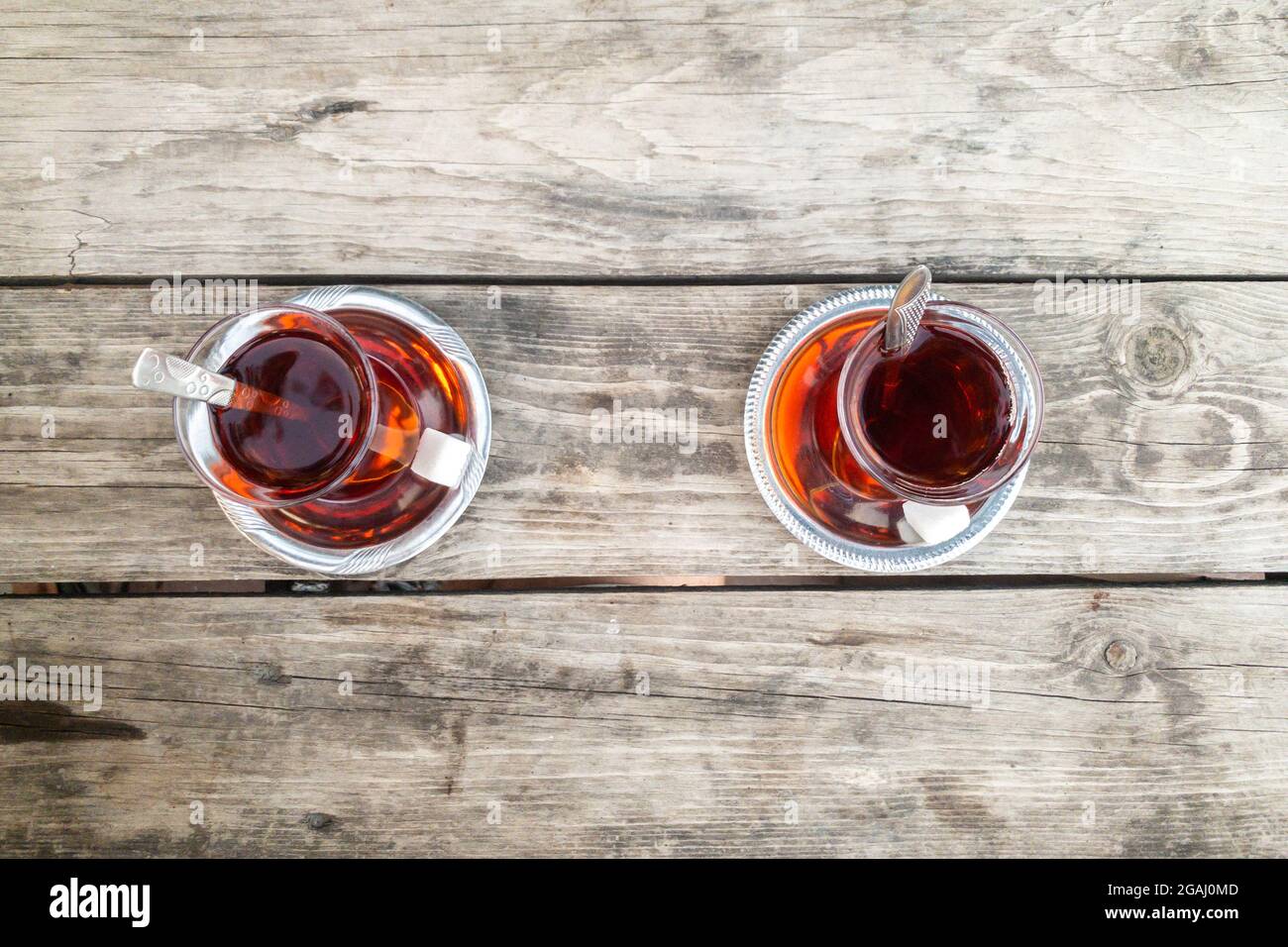 Two Glass of tea isolated on a natural brown hardwood table. Textured Wallpaper. High quality photo Stock Photo