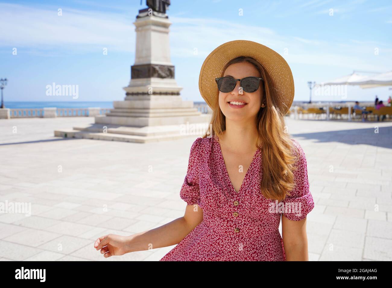 Welcome in Apulia. Portrait of pretty stylish girl smiling looking at camera in Otranto, Salento, Italy. Stock Photo