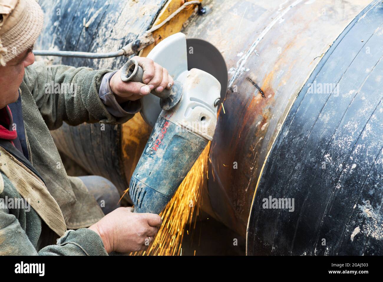 Odessa, Ukraine October 11, 2016 Repair of heating duct. The workers