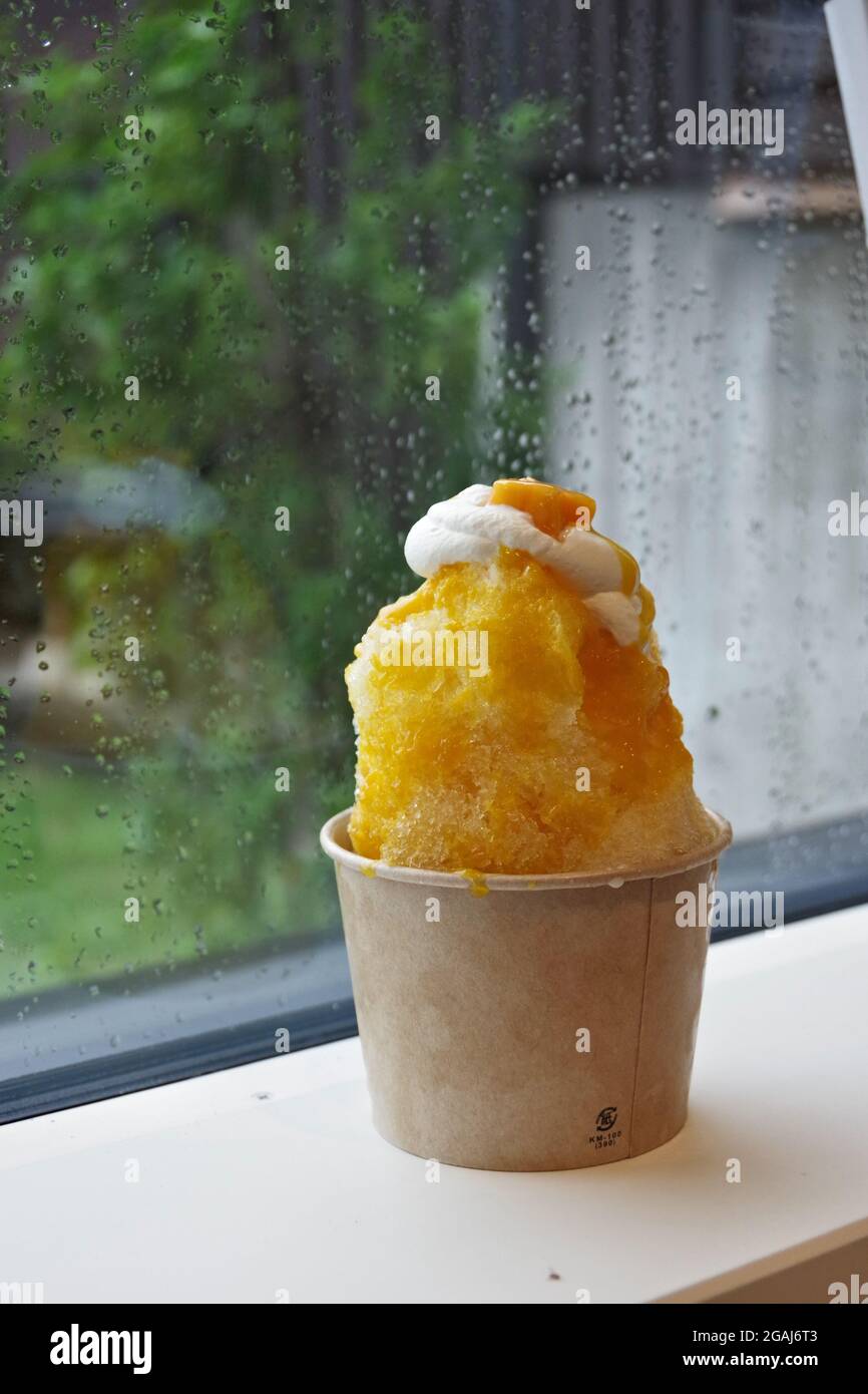 Nagano, Japan, 2021-31-07, Cup of Kakigori, a traditional Japanese shaved ice served with syrups. Stock Photo
