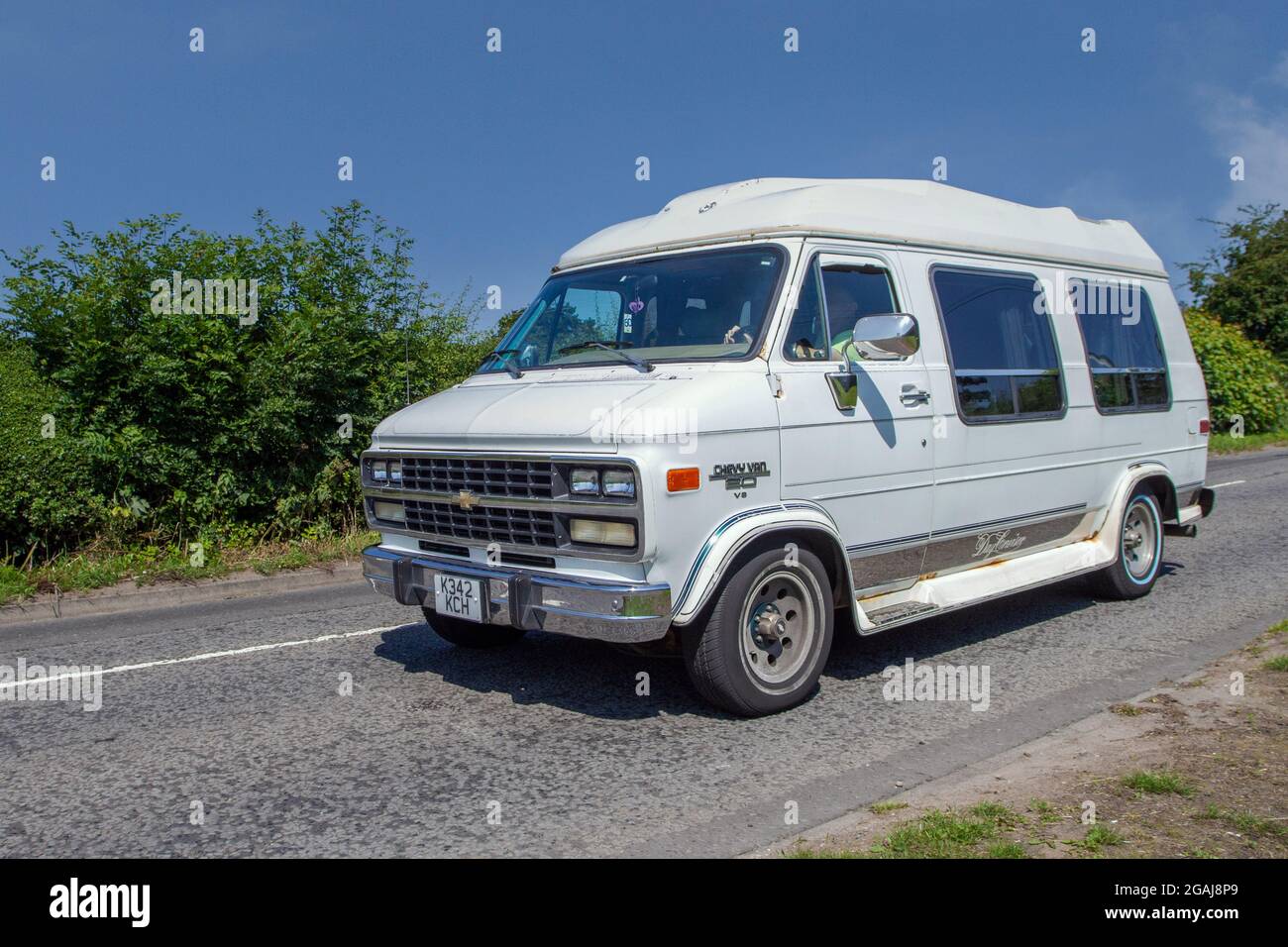 1992 90s white Chevrolet V8 Day van Cruiser 5700cc petrol camper van  en-route to Capesthorne Hall classic July car show, Cheshire, UK Stock  Photo - Alamy