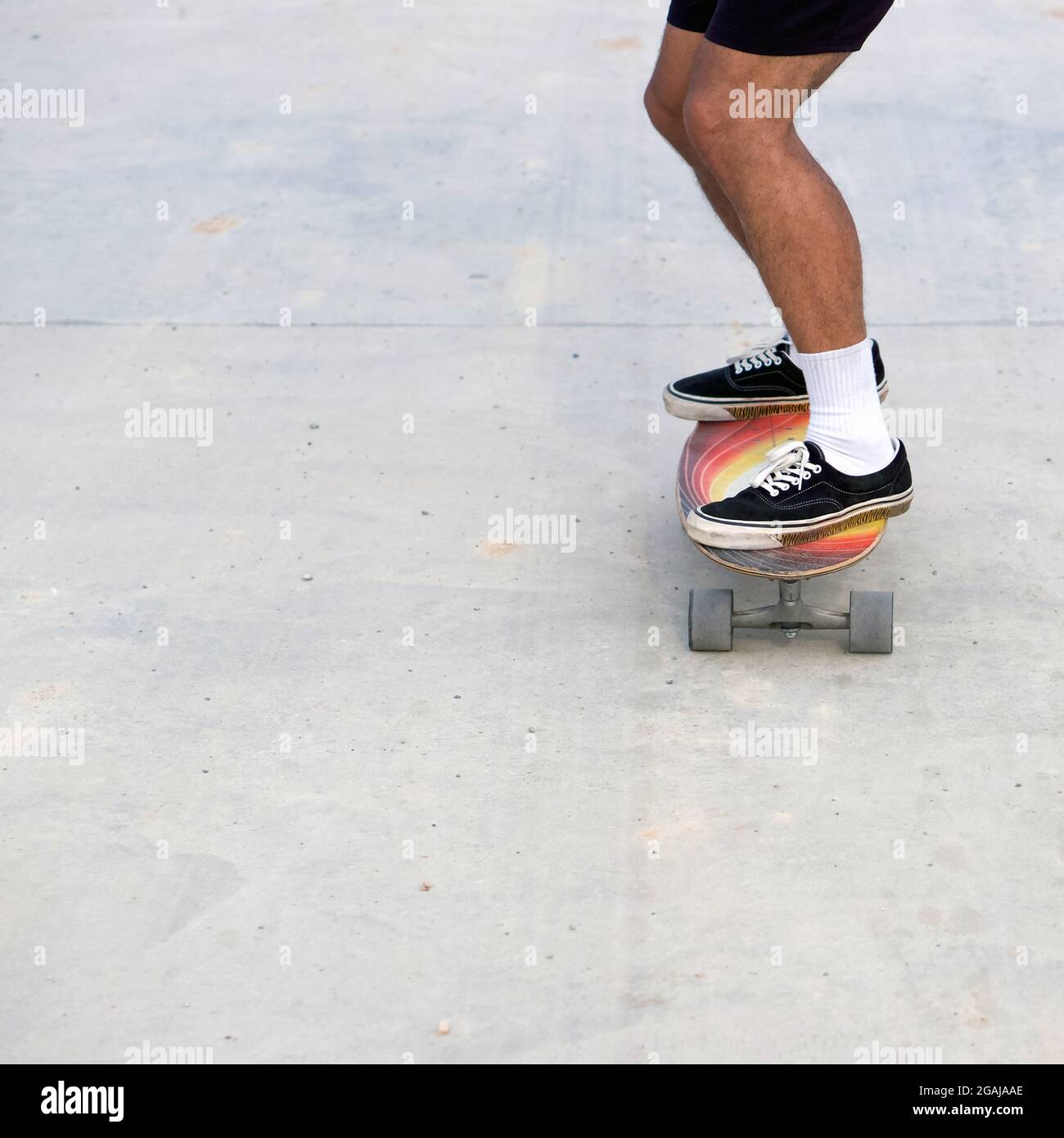 Skateboarding on road surface with dirt and sand. Can cause an accident