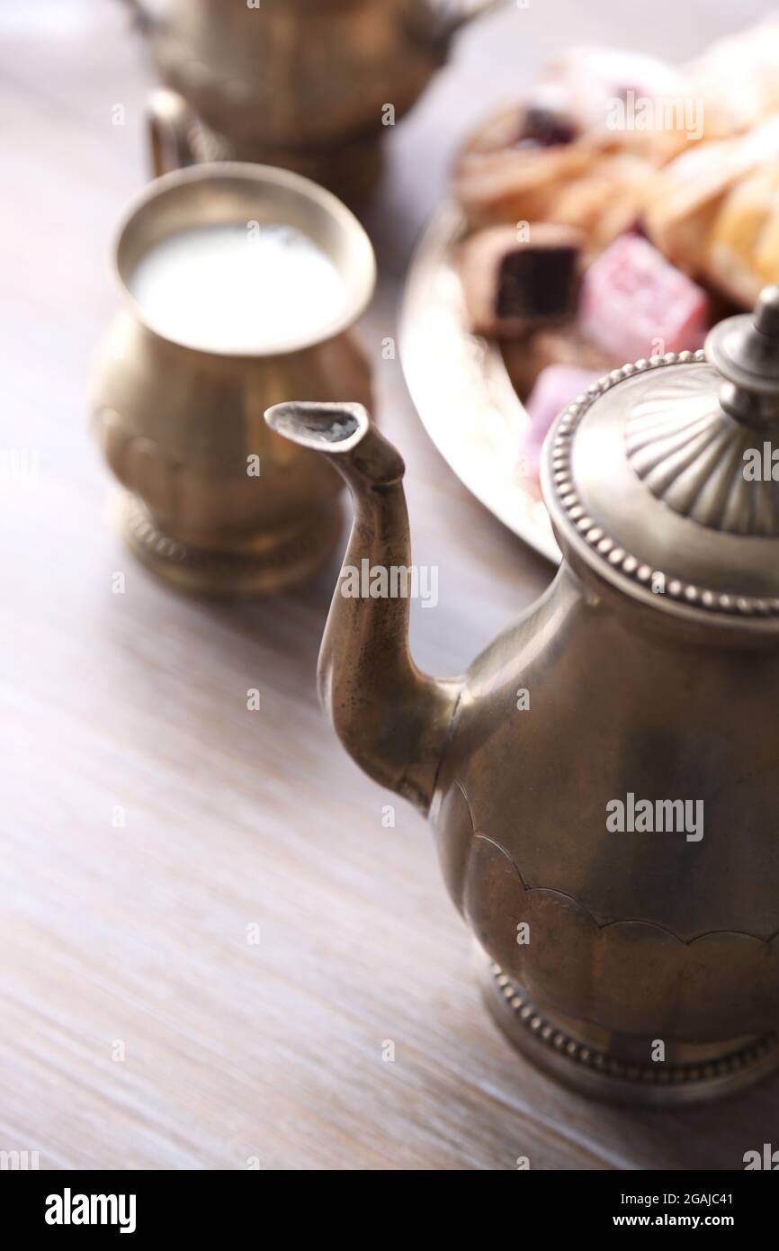 Antique teaset with Turkish delight and baking on table closeup Stock