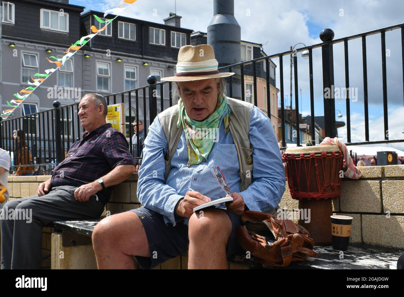 Bantry, West Cork, Ireland. 30th July 2021. Ian Bailey’s appeal against his conviction for drug driving and the possession of drugs has been adjourned until October. Pictured below Ian Bailey at Bantry market selling books and signing them. Credit: Karlis Dzjamko/Alamy Live News Stock Photo