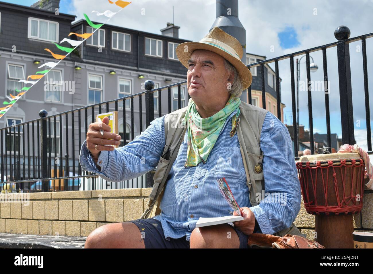 Bantry, West Cork, Ireland. 30th July 2021. Ian Bailey’s appeal against his conviction for drug driving and the possession of drugs has been adjourned until October. Pictured below Ian Bailey at Bantry market selling books and signing them. Credit: Karlis Dzjamko/Alamy Live News Stock Photo