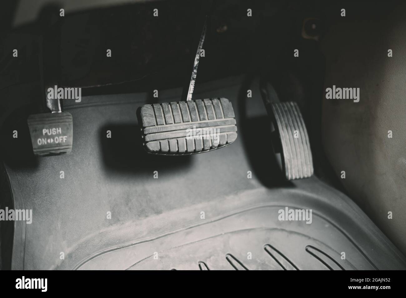 Old retro gas pedals and brakes in a car. Stock Photo