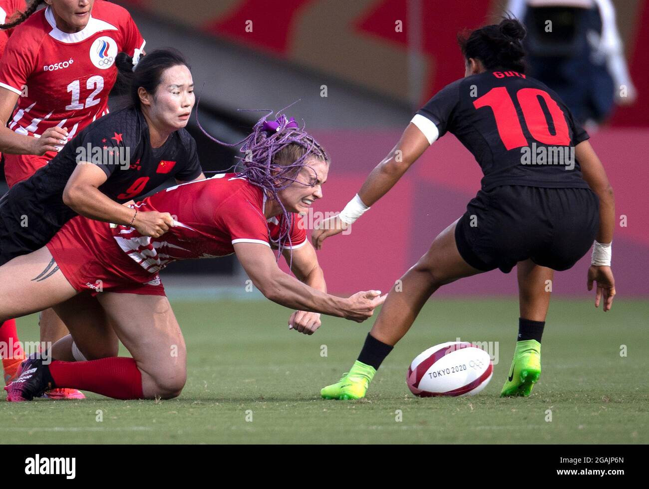 Tokyo, Japan. 31st July, 2021. Yang Feifei (2nd L) of China competes with Alena Tiron (2nd R) of ROC during the women's placing 7-8 match of rugby sevens between China and ROC at the Tokyo 2020 Olympic Games in Tokyo, Japan, July 31, 2021. Credit: Fei Maohua/Xinhua/Alamy Live News Stock Photo