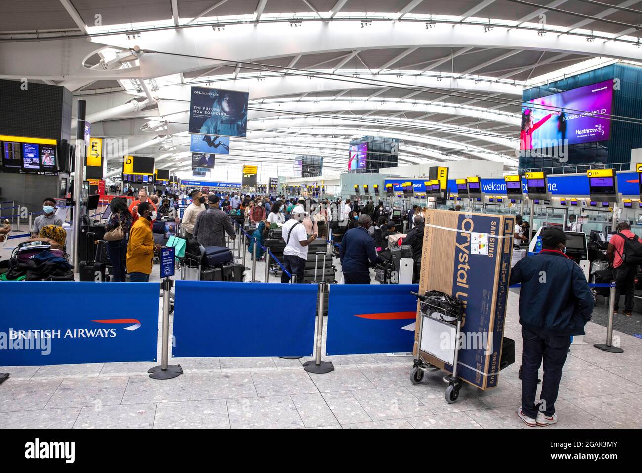 London, UK. 31st July, 2021. Departing Passengers arriving at Terminal 5. Adults who have been fully vaccinated through the NHS now don't need to self-isolate when they return from most amber list countries. Children also don't have to quarantine. Credit: Mark Thomas/Alamy Live News Stock Photo