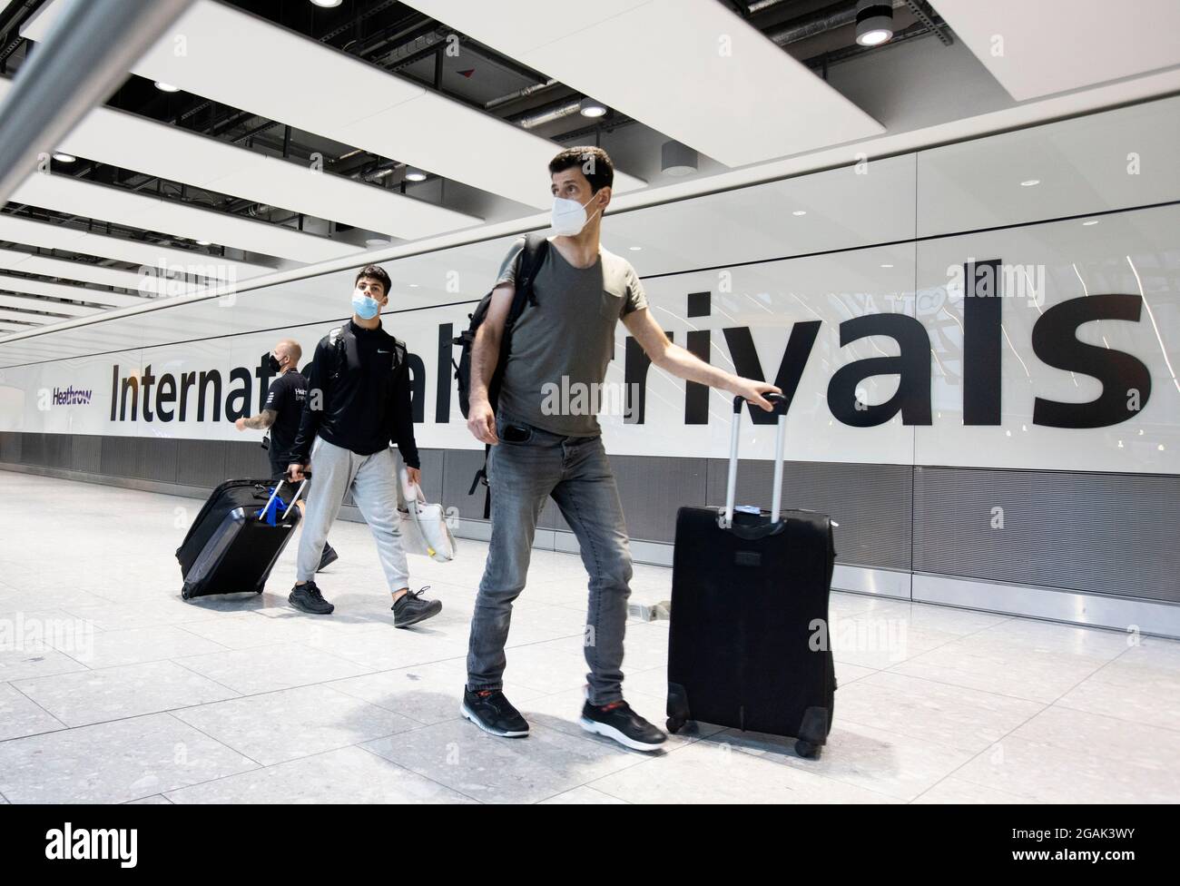 London, UK. 31st July, 2021. Passengers arriving at Terminal 5. Adults who have been fully vaccinated through the NHS now don't need to self-isolate when they return from most amber list countries. Children also don't have to quarantine. Credit: Mark Thomas/Alamy Live News Stock Photo