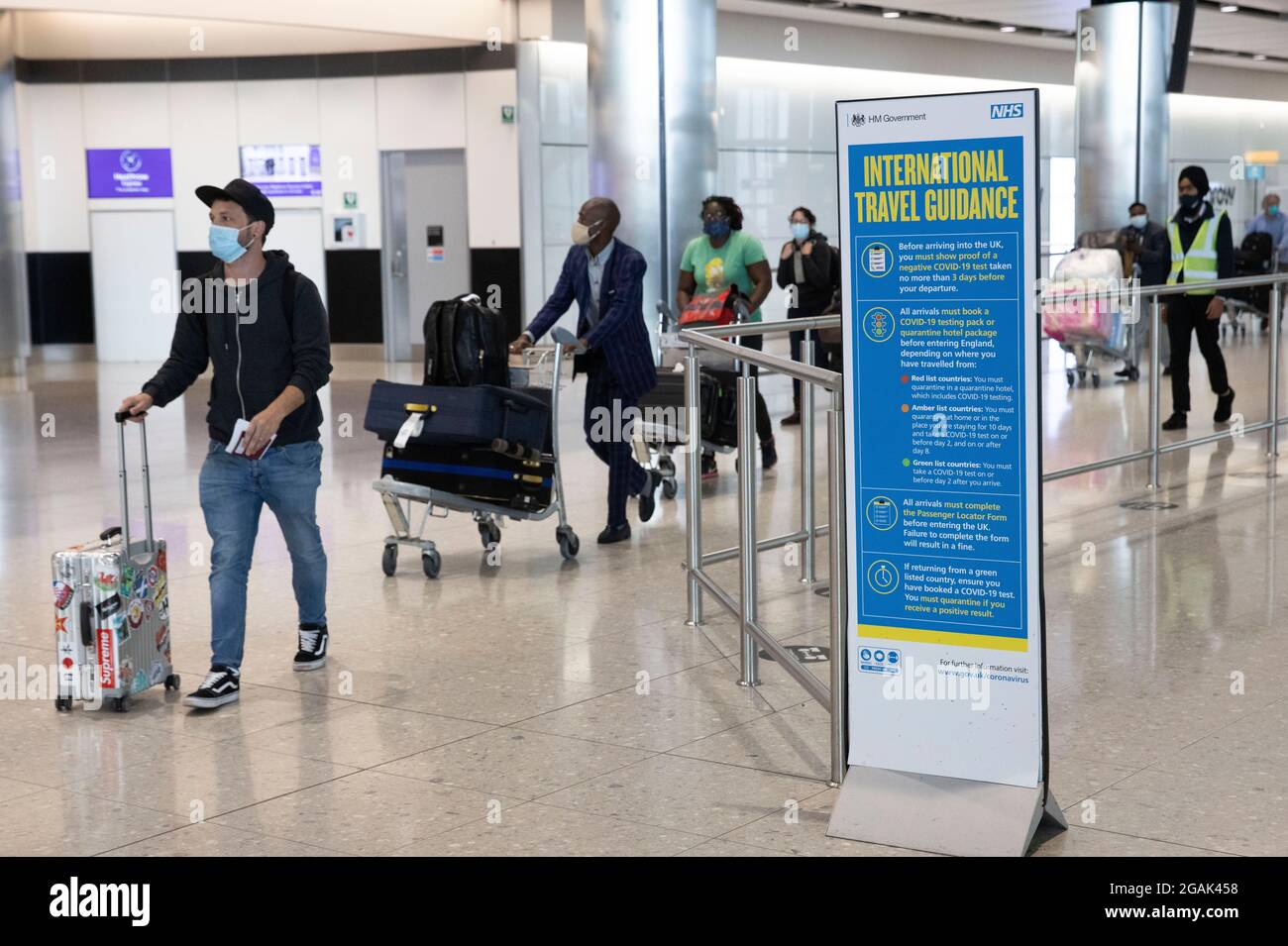 London, UK. 31st July, 2021. Passengers arriving at Terminal 2. Adults who have been fully vaccinated through the NHS now don't need to self-isolate when they return from most amber list countries. Children also don't have to quarantine. Credit: Mark Thomas/Alamy Live News Stock Photo