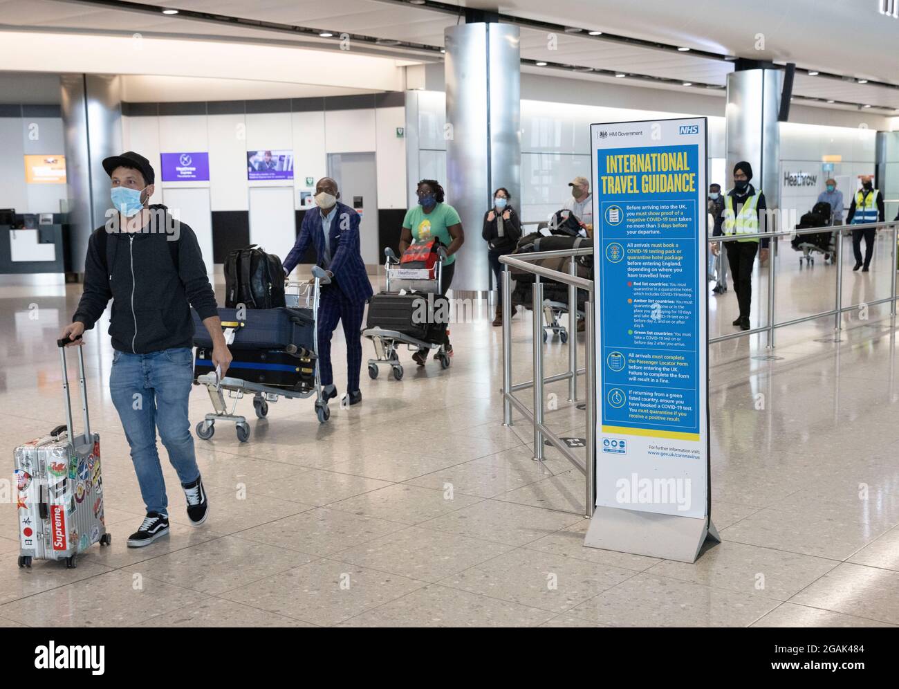 London, UK. 31st July, 2021. Passengers arriving at Terminal 2. Adults who have been fully vaccinated through the NHS now don't need to self-isolate when they return from most amber list countries. Children also don't have to quarantine. Credit: Mark Thomas/Alamy Live News Stock Photo