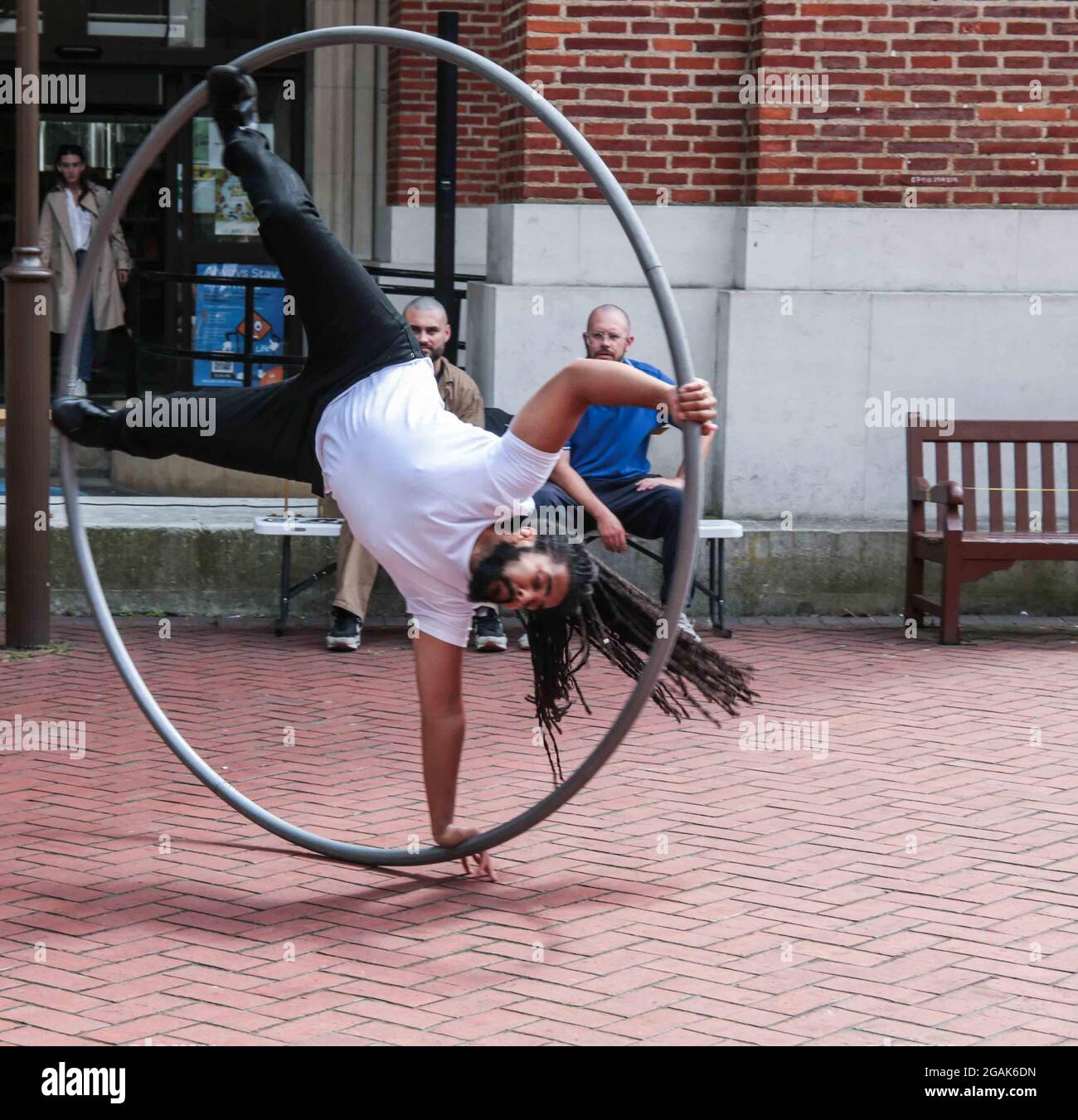 Man with long hair in a giant hole hoop hi-res stock photography and images  - Alamy